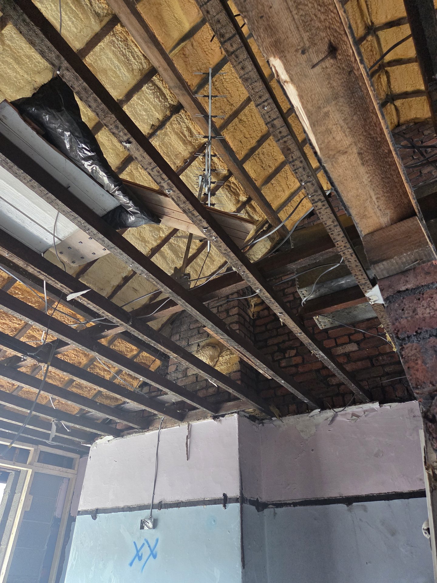 Loft spray foam insulation between rafters